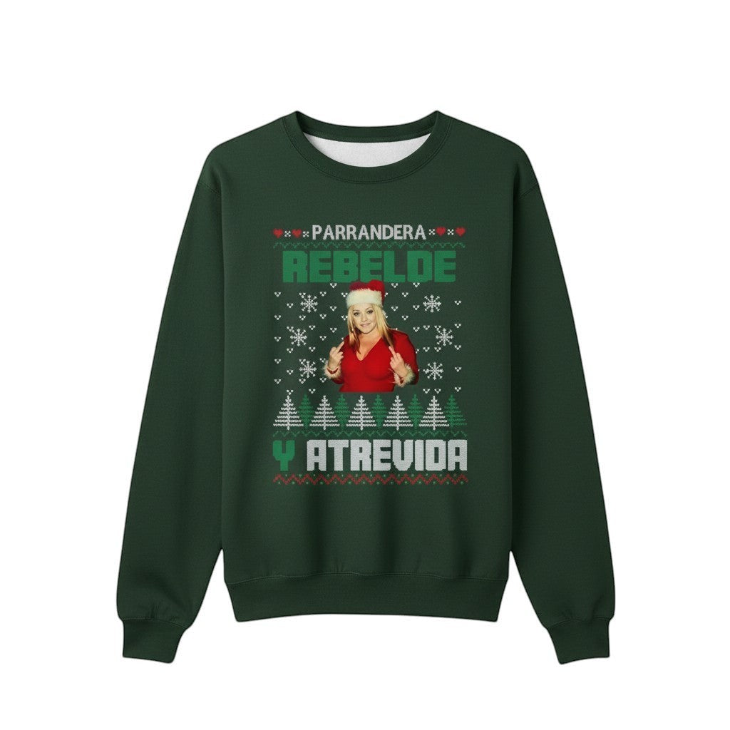 COMFORT green unisex graphic sweatshirt with "Parrandera Rebelde Y Atrevida" text, snowflakes, trees, and a woman in a Santa hat.