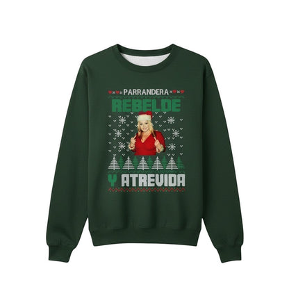 COMFORT green unisex graphic sweatshirt with "Parrandera Rebelde Y Atrevida" text, snowflakes, trees, and a woman in a Santa hat.