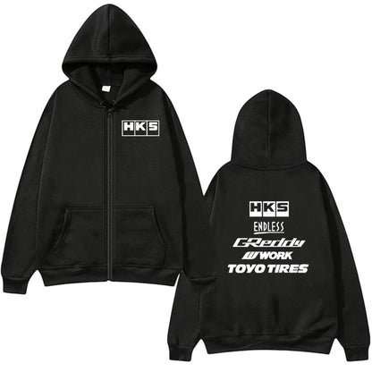 COMFORTHKS graphic zip-up hoodie with multiple brand logos on black fabric. Features front pockets and a hood.