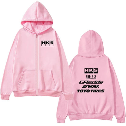 COMFORTHKS graphic zip-up hoodie in pink with multiple brand logos on front and back. Features a full zip, hood, and pockets.