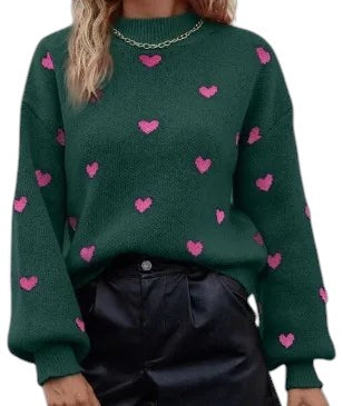 COMFORT green knit sweater with pink heart pattern, long sleeves, crew neck, and ribbed cuffs/hem.