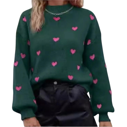 COMFORTH green knit sweater with pink heart pattern, long sleeves, crew neck, and ribbed cuffs and hem.