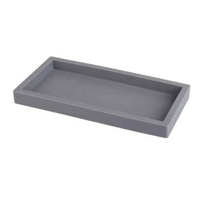 COMFORTH grey resin rectangular decorative tray with a minimalist design, perfect for countertop organization.