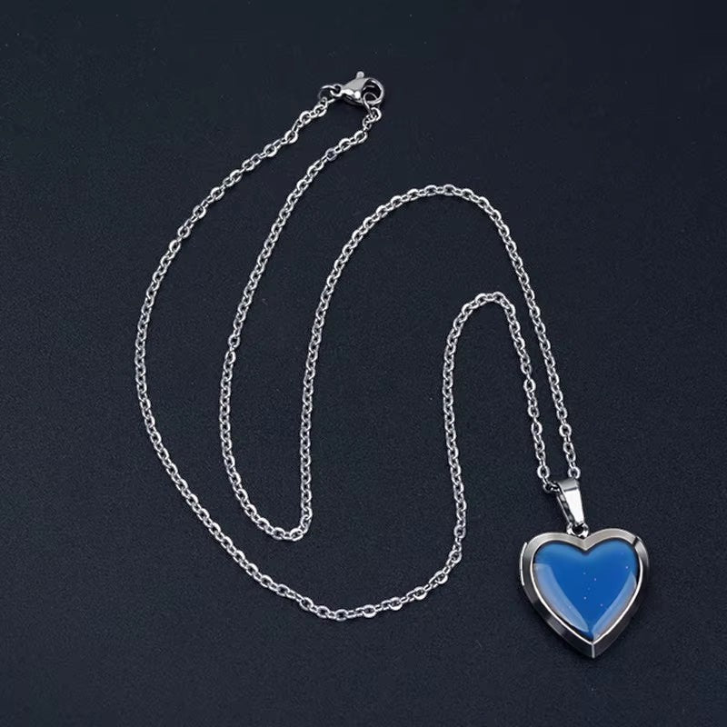 COMFORTH Heart shaped locket pendant necklace with a blue thermochromic stone on a silver chain