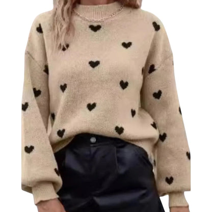 COMFORTH beige knit sweater with black heart pattern, crew neck, long sleeves, and ribbed cuffs and hem.