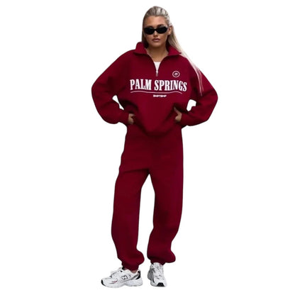 COMFORTHere Palm Springs quarter zip sweatshirt in deep red, featuring a relaxed fit and graphic text across the chest.