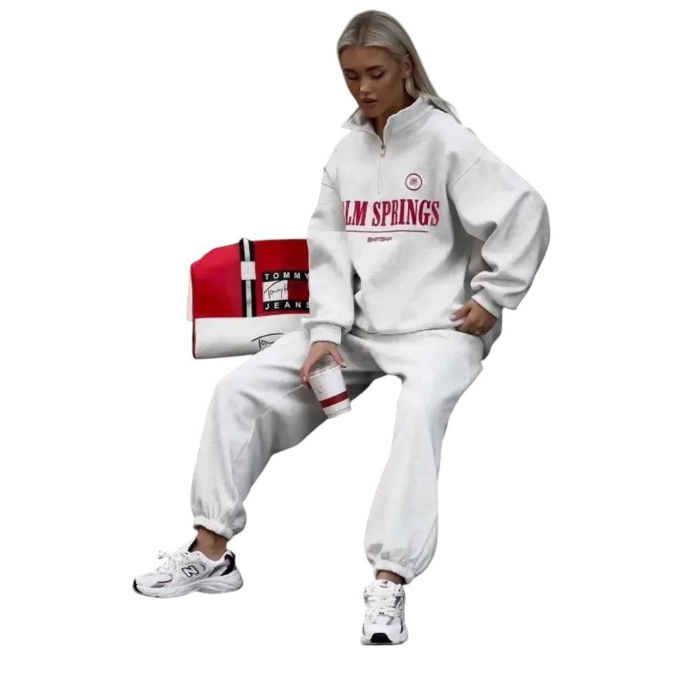 COMFORTHere white cotton blend quarter zip sweatshirt with "PALM SPRINGS" graphic. Relaxed fit with ribbed cuffs and hem.