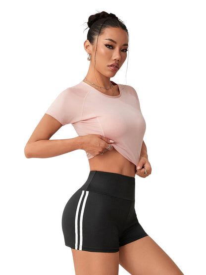 COMFORTHigh waisted black athletic shorts with white side stripe detail. Moisture-wicking fabric for workouts.
