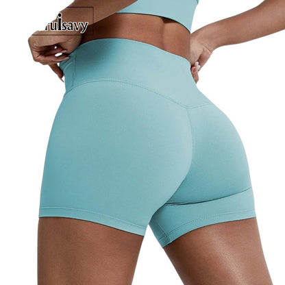 COMFORTHere women's high-waisted athletic shorts in light blue. Seamless, four-way stretch fabric for workouts.