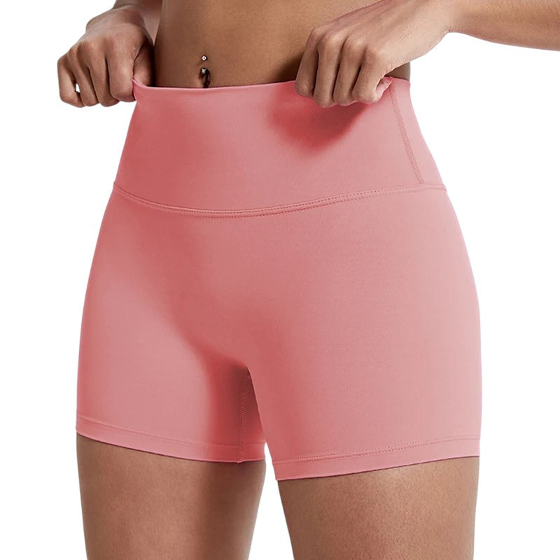 COMFORTHigh-waisted coral athletic shorts for women, seamless, four-way stretch, moisture-wicking fabric.