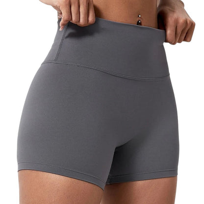 COMFORTHere grey high-waisted athletic shorts for women, seamless, four-way stretch, moisture-wicking fabric.