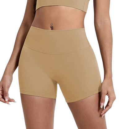 COMFORT tan high-waisted athletic shorts for women, seamless, four-way stretch, moisture-wicking fabric for yoga or running.