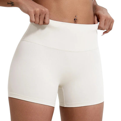 COMFORTHere white high-waisted athletic shorts for women, seamless design, tummy control, four-way stretch fabric.