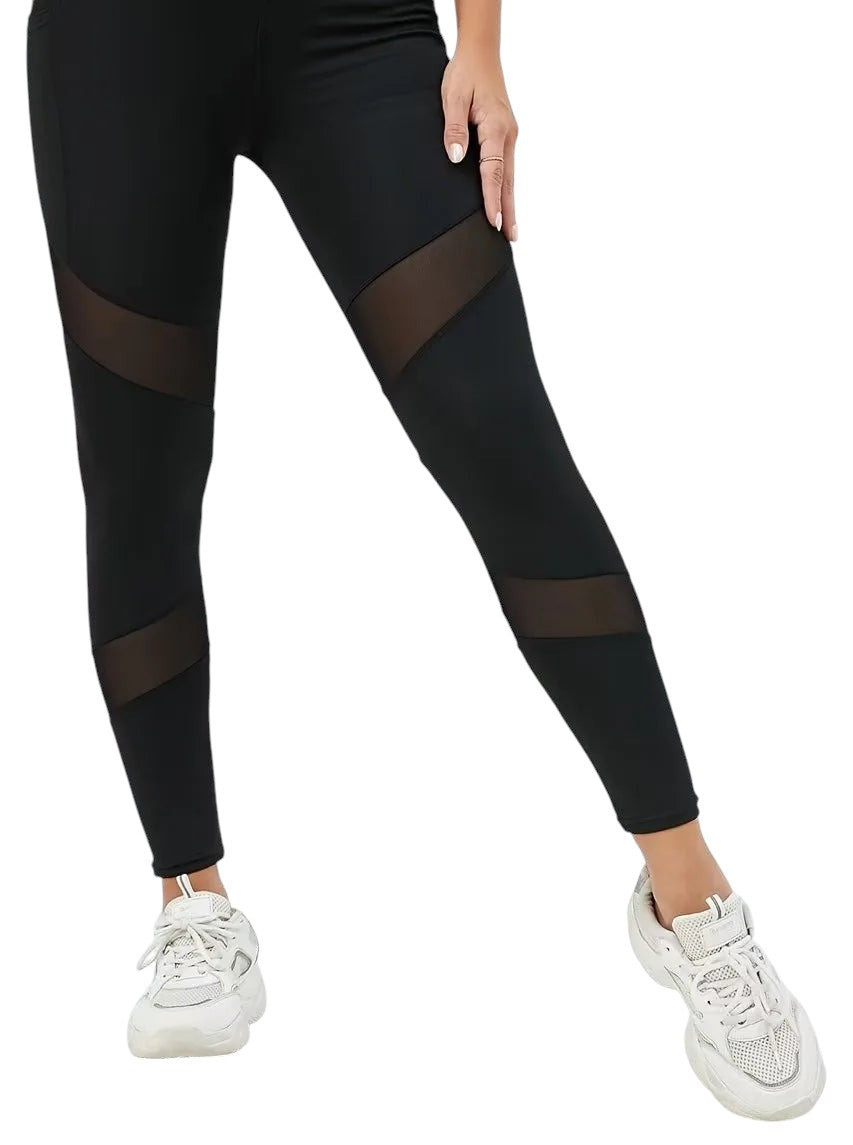 COMFORTHigh waisted black leggings with diagonal mesh panels on the legs and side pockets.