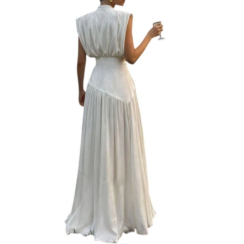 COMFORTH elegant ivory sleeveless deep V-neck maxi dress with flowing fabric and pleated skirt.