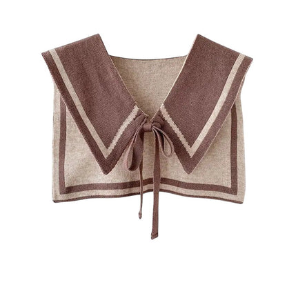 COMFORTH knit sailor collar in brown and beige with contrasting trim and tie closure. Detachable accessory.