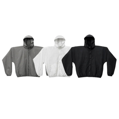 COMFORTH three lightweight hooded jackets in grey, white, and black with zipper closure and elasticated cuffs.