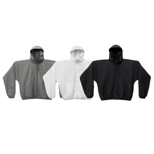 COMFORTH three lightweight hooded jackets in grey, white, and black with zipper closure and elasticated cuffs.