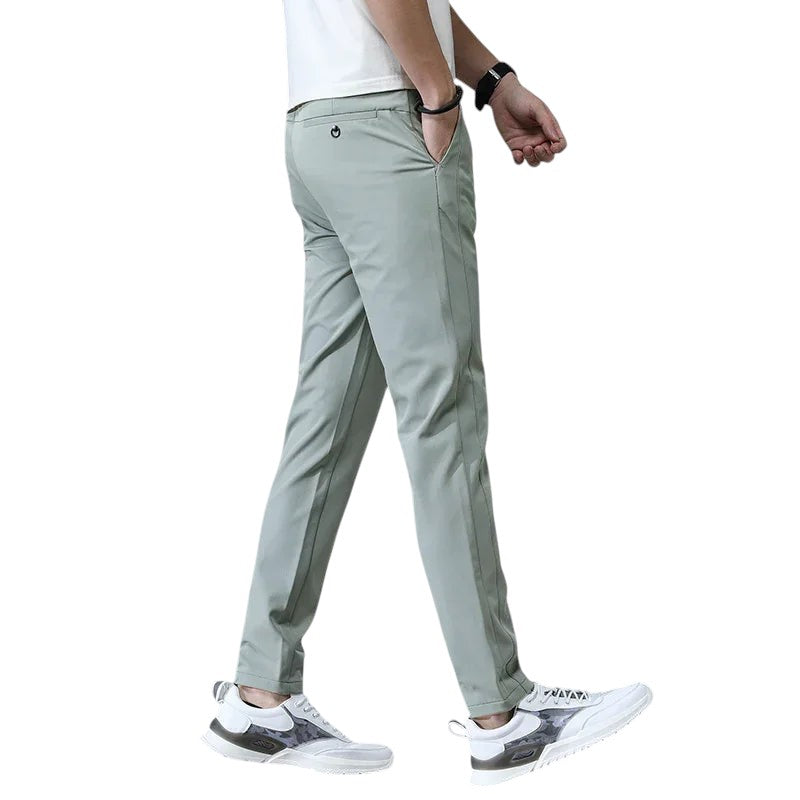 COMFORT men's light green casual stretch chino pants with a slim fit and button closure.