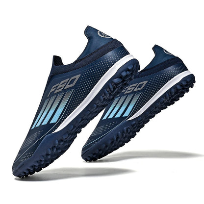 COMFORTH men's navy blue laceless soccer cleats with white accents and blue gradient stripes. Turf outsole.