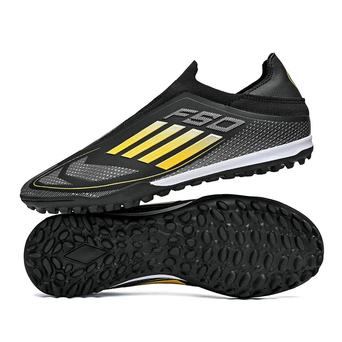 COMFORTH men's black and yellow laceless turf soccer cleats with sock-like upper and synthetic material.