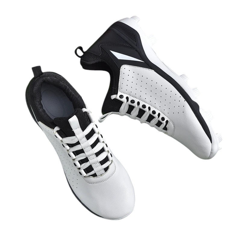 COMFORTH Men's white and black athletic cleats with perforated synthetic leather upper and lace-up closure.
