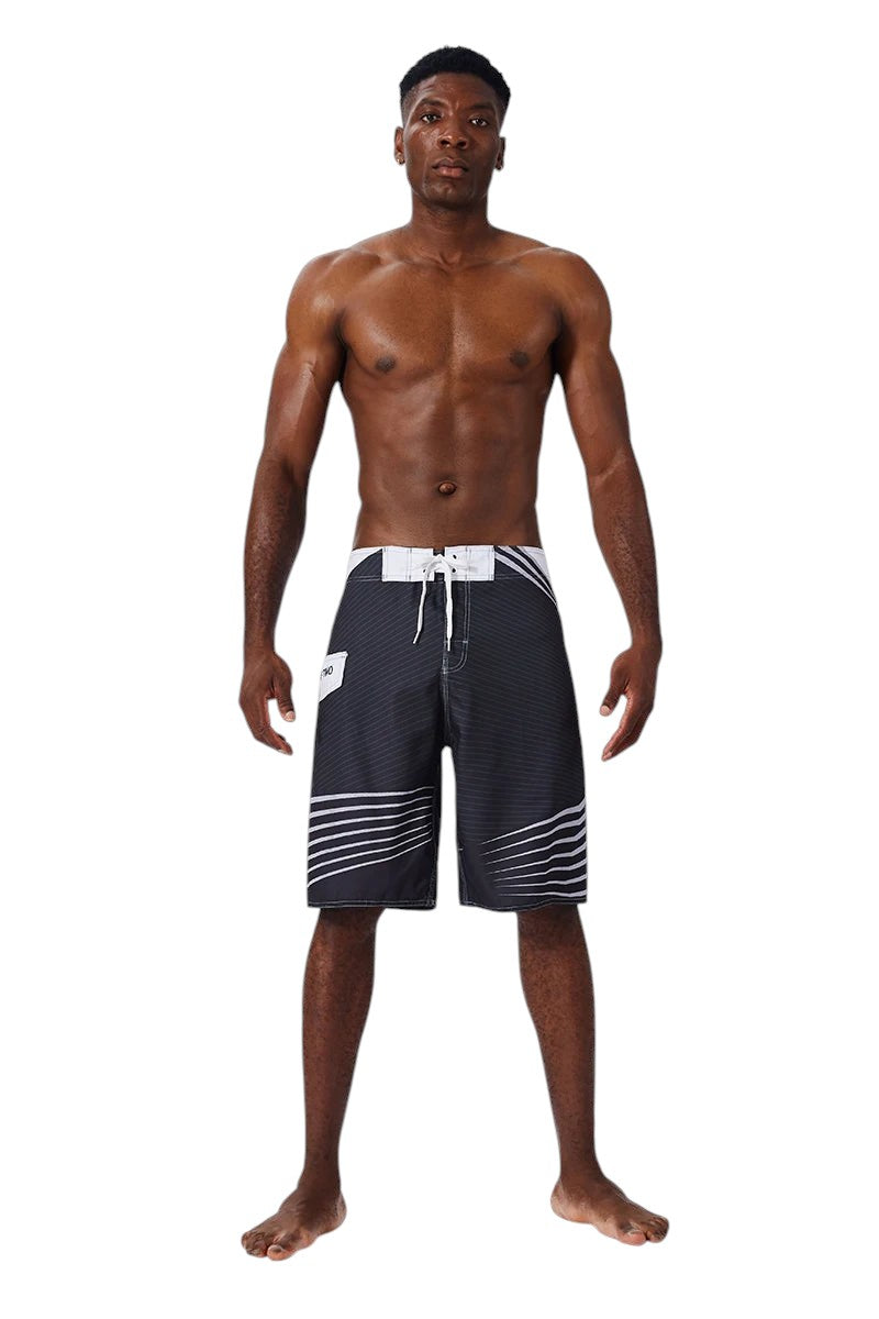 COMFORTH Men's black and white athletic striped board shorts with drawstring closure and quick-drying fabric.