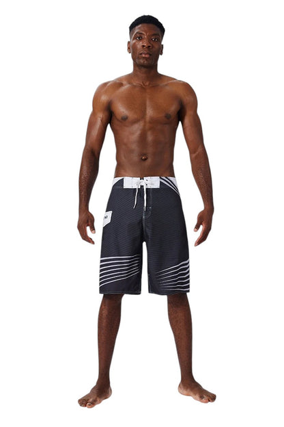 COMFORTH Men's black and white athletic striped board shorts with drawstring closure and quick-drying fabric.