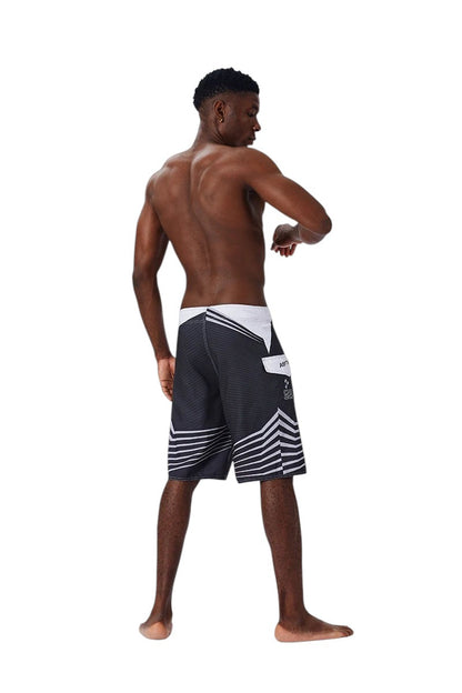 COMFORTH Men's black and white athletic striped board shorts with drawstring closure and side pocket.