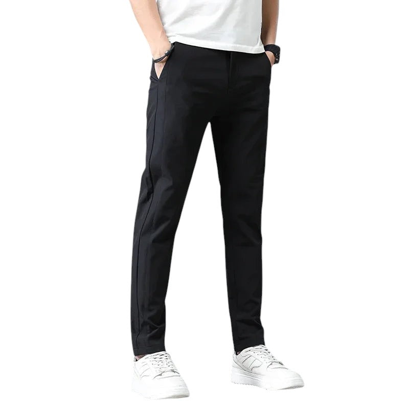 COMFORTH Men's black slim-fit stretch chino pants with pockets and belt loops.