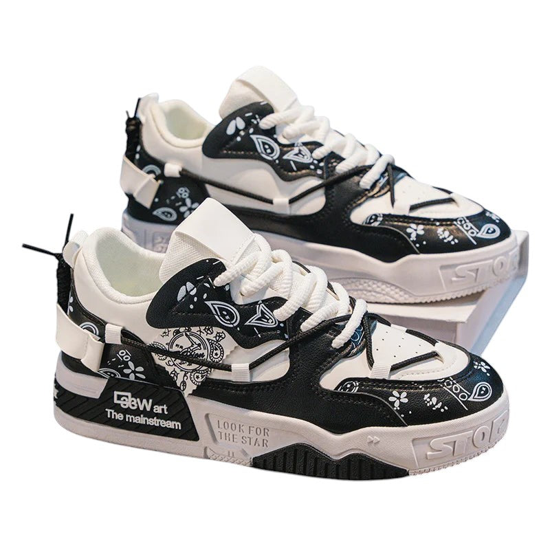 COMFORT Men's black and white fashion sneakers with graphic accents and chunky soles.