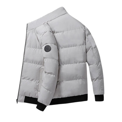 COMFORTH Men's light grey quilted puffer jacket with stand collar, black ribbed cuffs and hem.