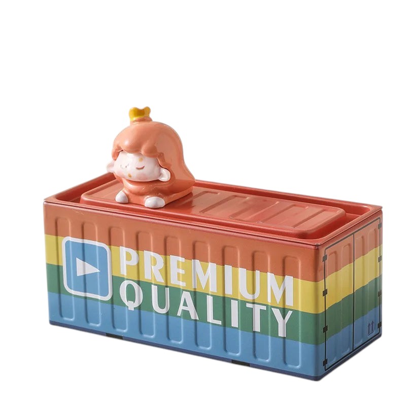 COMFORTH metal pen holder shaped like a shipping container with rainbow stripes and a cute cartoon figure on top.