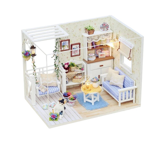 COMFORTH miniature dollhouse building kit with blue striped sofa, swing chair, and decorative plants.