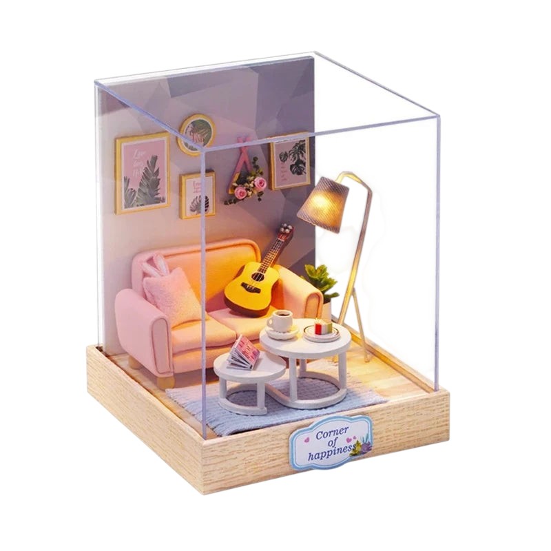COMFORTH miniature dollhouse building kit with pink sofa, guitar, coffee table, and floor lamp. Detailed interior scene.