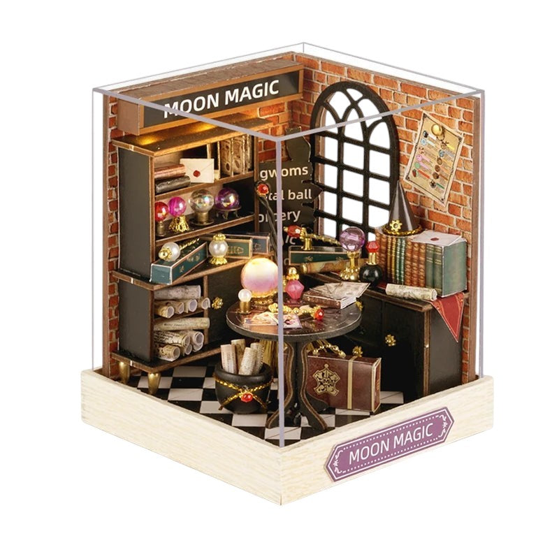 COMFORTH Miniature Dollhouse Building Kit, a magical room with brick walls, shelves, books, crystal balls, and a cauldron.