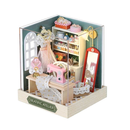 COMFORTH miniature dollhouse sewing room kit with pink sewing machine, dress form, mirror, and shelves of accessories.