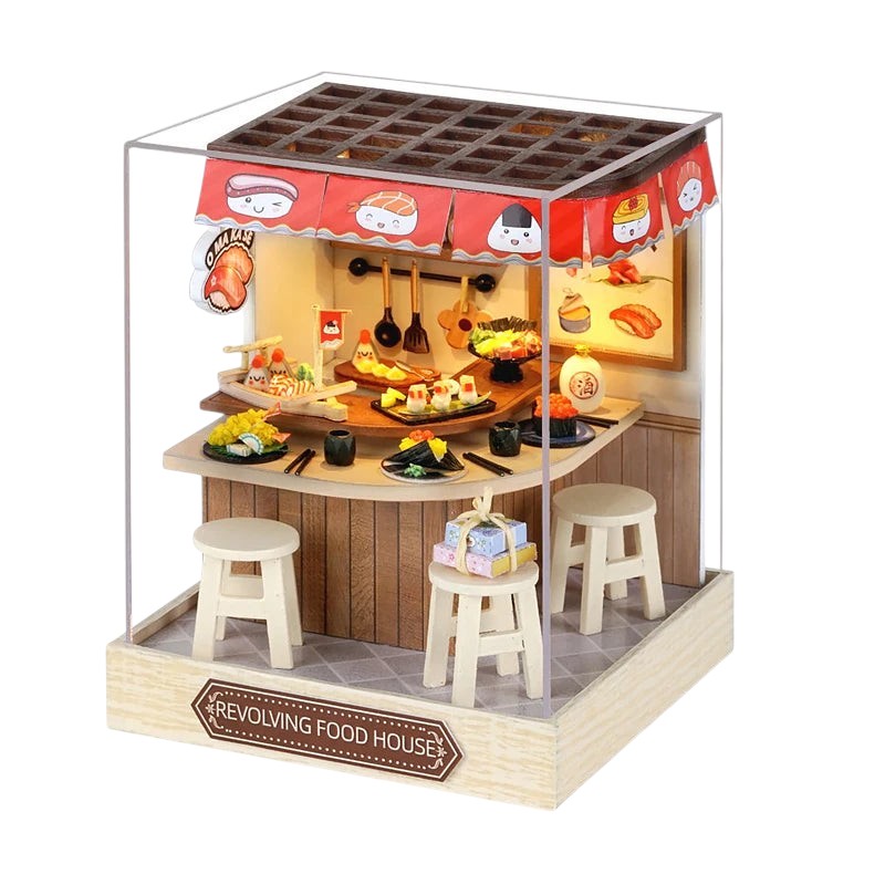COMFORTH miniature sushi restaurant building kit with tiny stools, sushi platters, and decorative Noren curtains.