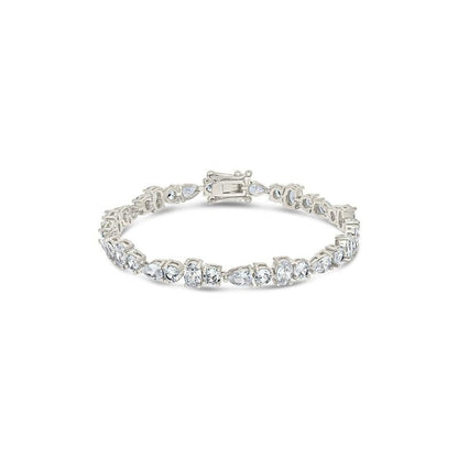 COMFORTH mixed shape tennis bracelet with round, oval, and pear cut crystal accents in a gold-tone finish.
