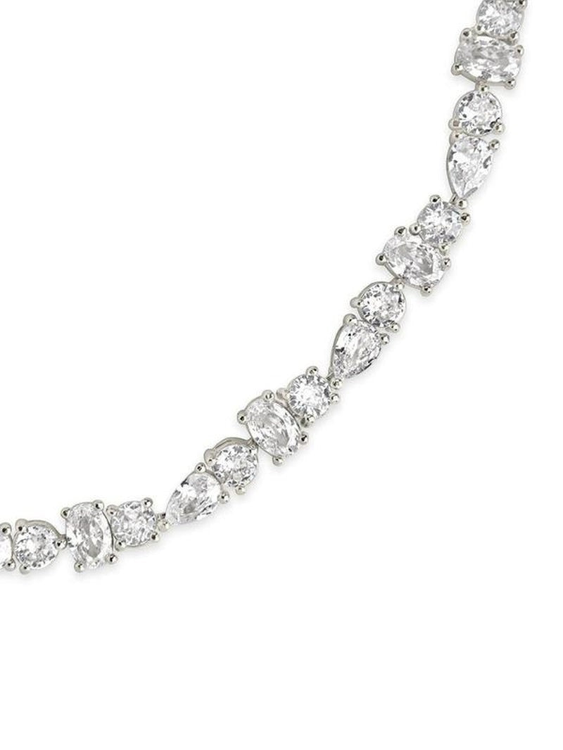 COMFORTH mixed shape tennis bracelet with round, oval, and pear cut crystal accents on a gold-tone finish.