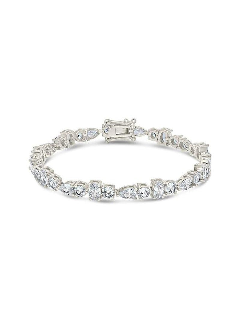 COMFORTH mixed shape tennis bracelet with round, oval, and pear cut crystal accents on a silver-tone finish.