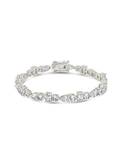 COMFORTH mixed shape tennis bracelet with round, oval, and pear cut crystal accents on a silver-tone finish.
