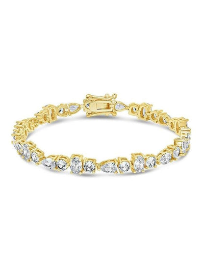 COMFORTH Mixed shape tennis bracelet with clear crystal accents in round, oval, and pear cuts on a gold-tone finish.