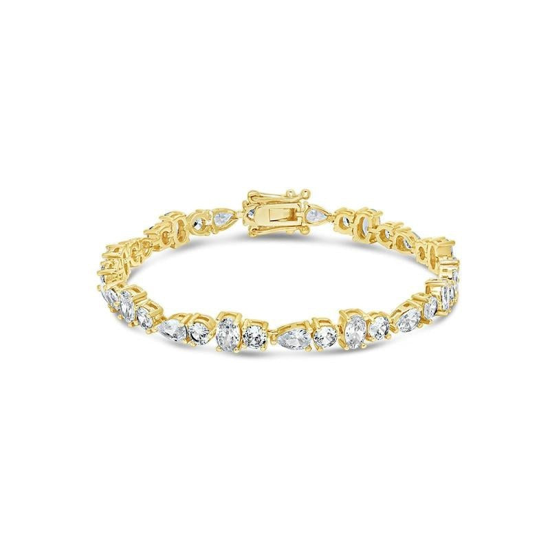 COMFORTH mixed shape tennis bracelet with round, oval, and pear cut crystal accents on a gold-tone finish.