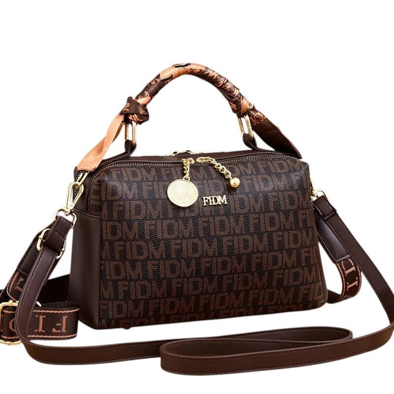 COMFORTH fashion monogram satchel handbag in brown faux leather with gold-tone hardware and scarf detail on handles.