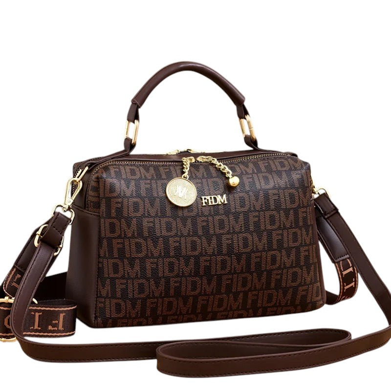 COMFORTH monogram satchel handbag in brown faux leather with gold-tone hardware and detachable strap.