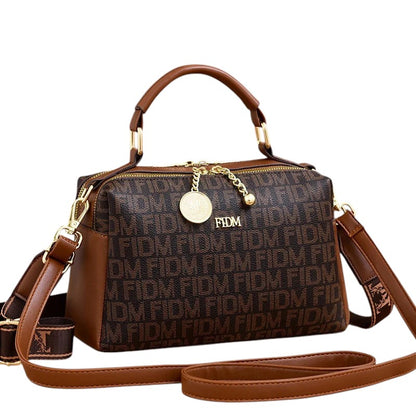 COMFORTH monogram satchel handbag in brown faux leather with gold-tone hardware and detachable strap.