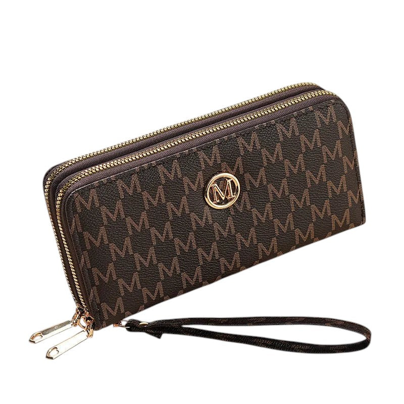 COMFORTH brown faux leather wristlet wallet with all-over "M" monogram and gold-tone emblem. Features dual zips and card slots.