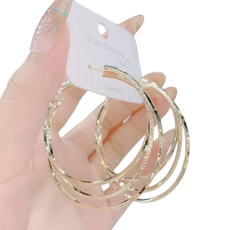 COMFORTH Elegant multi-layered gold hoop earrings with textured finish. Lightweight metal, perfect for day or evening wear.
