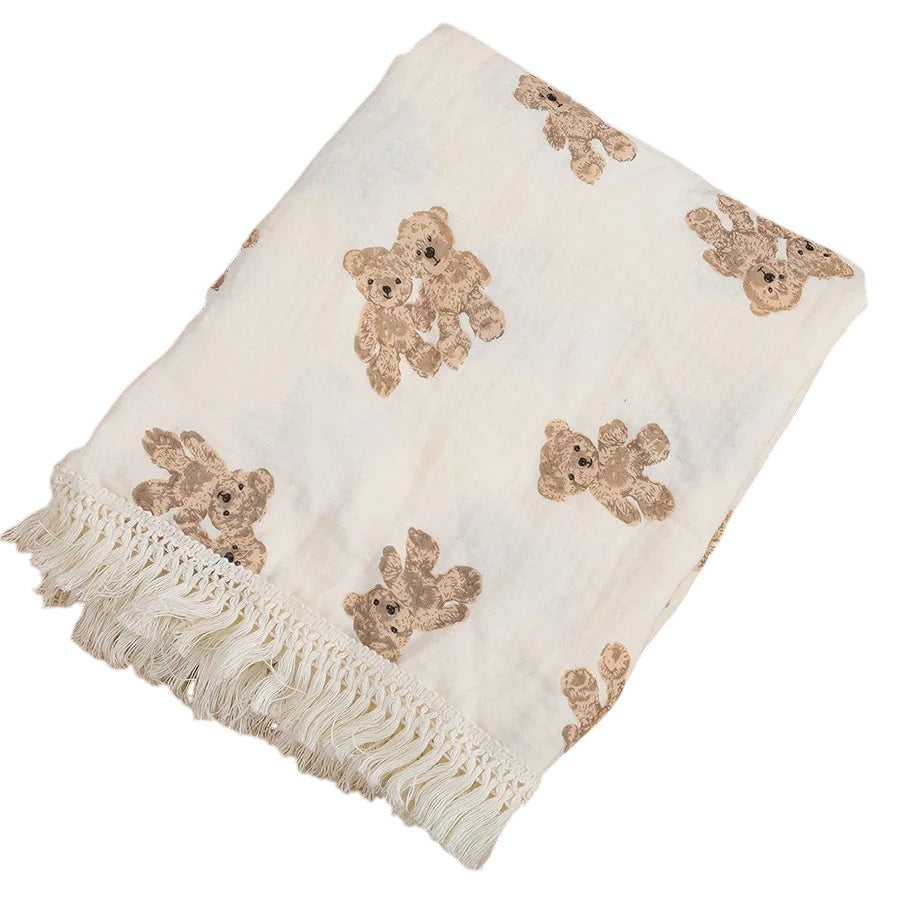 COMFORTH muslin blanket with all-over teddy bear print and fringe detail. Cream with brown bears.